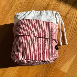 Striped Drawstring Bag with bean bag inside to keep food warm for service.